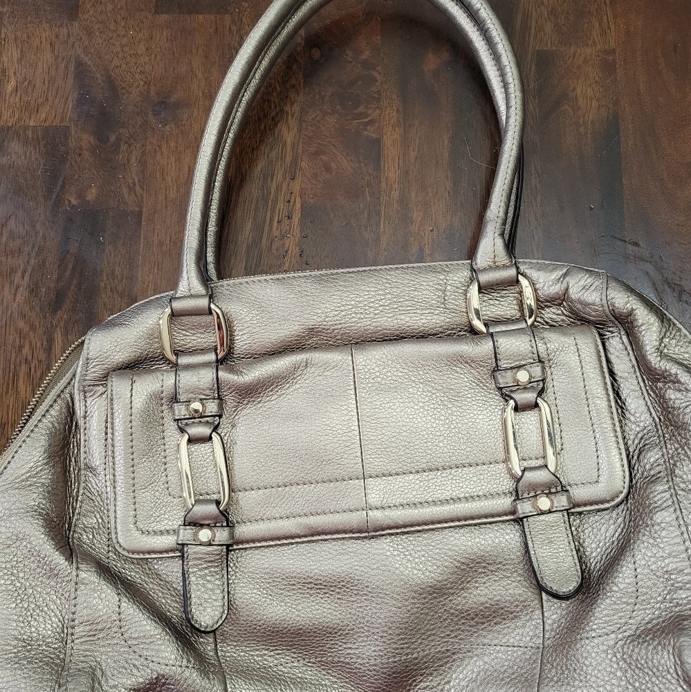 B. Makowsky gold purse with dust bag